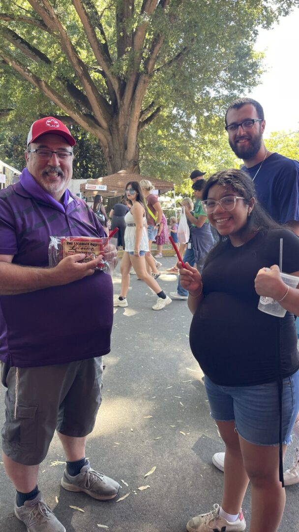 Friends posing with snacks outdoors